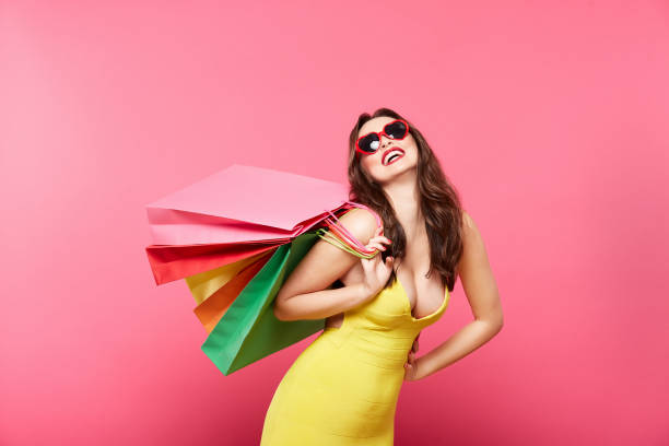 istock Happy girl doing shopping 1129639360