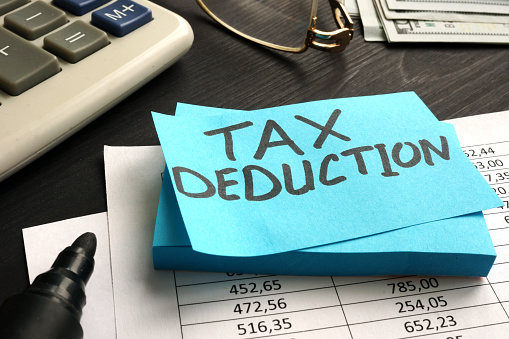 Tax deduction written on a piece of paper.