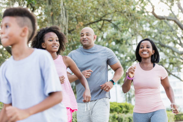 istock Interracial family walking in park together 1129642122