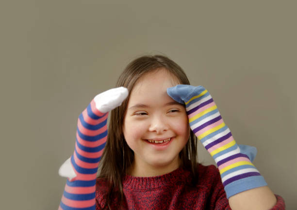 istock Beautiful girl smiling with socks 1129643922