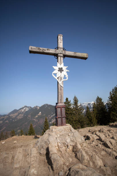 istock Summit cross of mountain Heuberg, Bavaria, springtime 1129644802