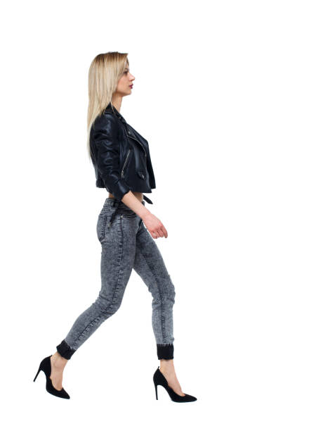 istock side view of walking woman. 1129645166