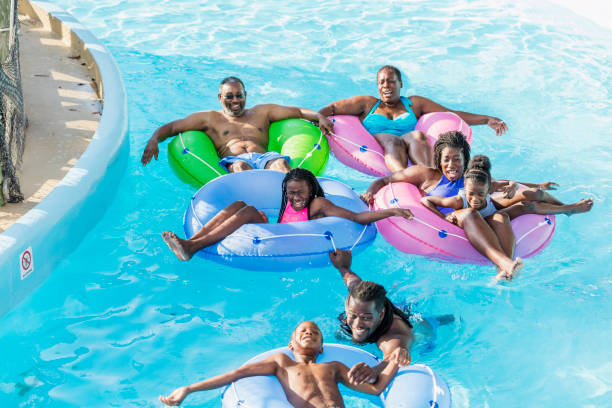istock Multi-generation family at water park on lazy river 1129645332