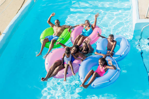 istock Multi-generation family at water park on lazy river 1129645350