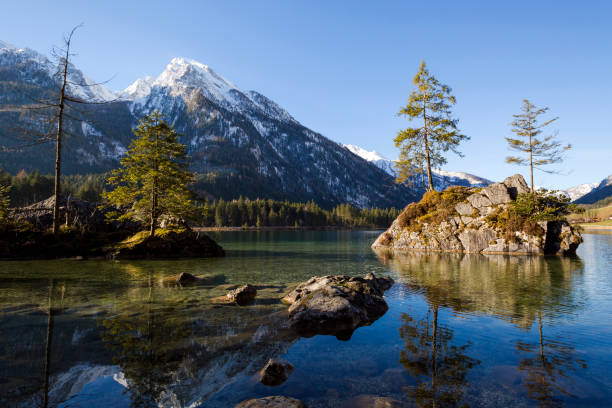 istock Golden sunrise at famous lake Hintersee, Bavaria, Germany 1129645366