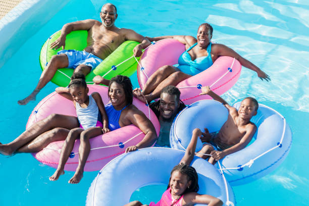 istock Multi-generation family at water park on lazy river 1129645425