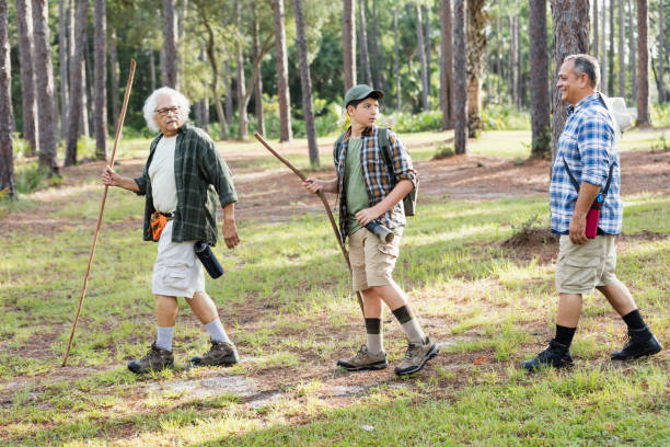 istock Multi-generation Hispanic family hiking in woods 1129646950