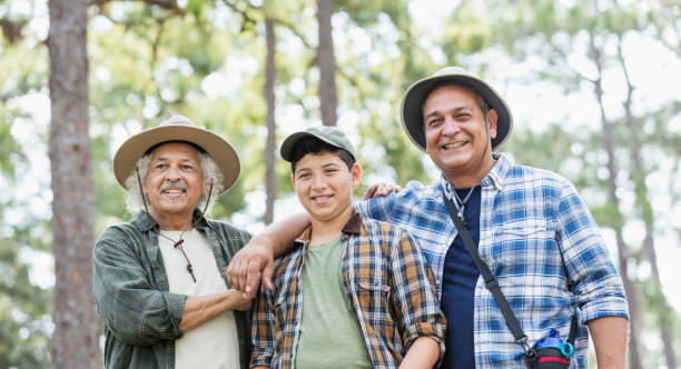 istock Multi-generation Hispanic family hiking in woods 1129648431