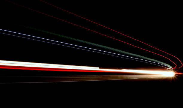 istock lights of cars with night 1129648621