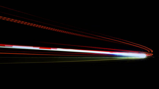 istock lights of cars with night 1129648625
