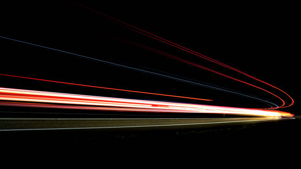 istock lights of cars with night 1129648677