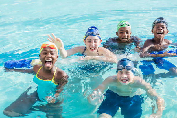 istock Multi-ethnic children on swim team in pool 1129649644
