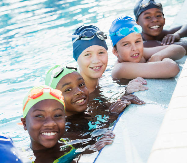 istock Multi-ethnic children on swim team in pool 1129649796