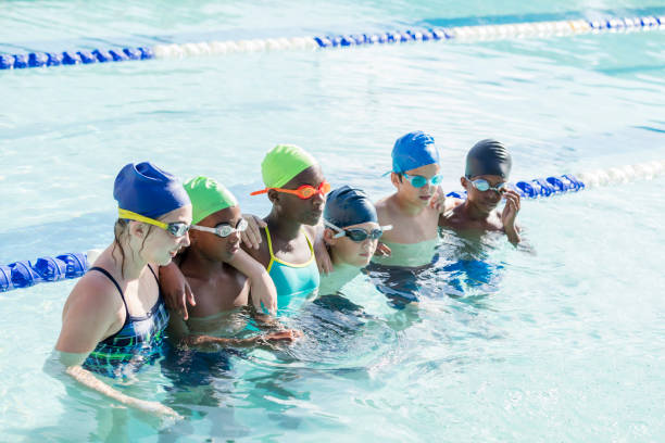 istock Multi-ethnic children on swim team in pool 1129649972
