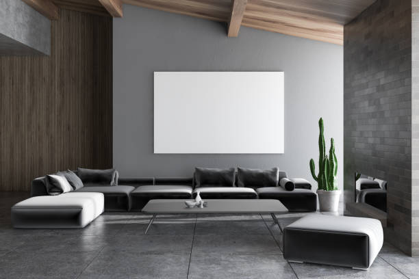 istock Gray living room with fireplace and poster 1129650962