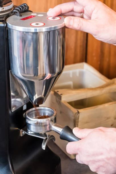 istock Barista grinding coffee beans with grinder to making espresso coffee 1129651894