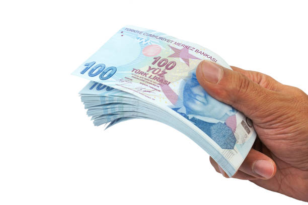 turkish banknotes . paying money. turkish lira - try or tl - tl imagens e fotografias de stock