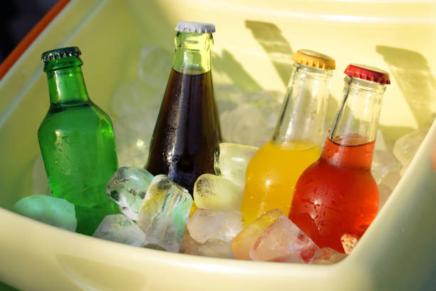 istock Colorful soda drinks and filled ice cubes in a coolbox 1129655547