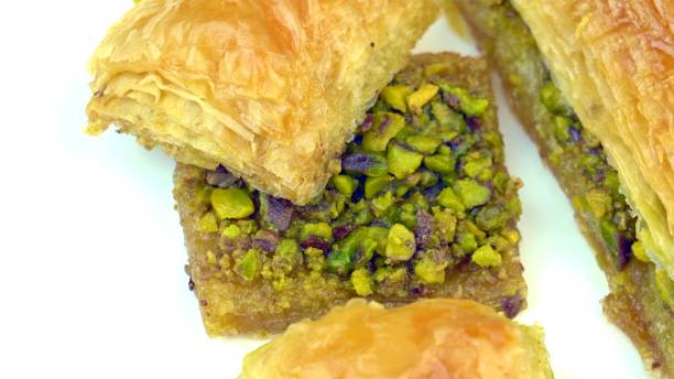 istock Traditional, delicious Turkish baklava with green pistachio nuts 1129655593
