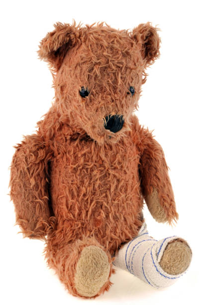 istock Teddy bear with a bandaged foot 1129659729