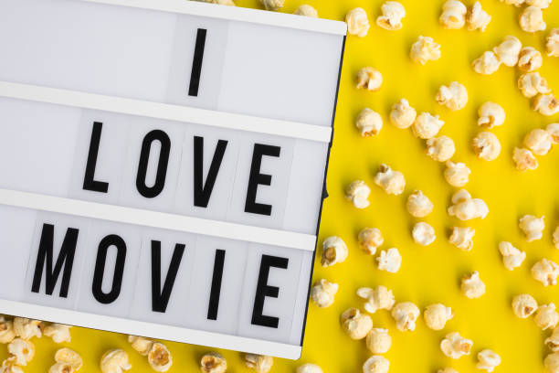 istock I love movie text on light box with pop corn on pastel color background 1129661672