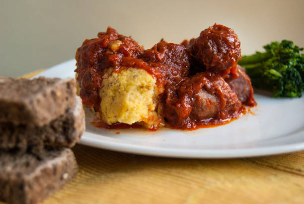Yellow polenta with sausage and tomato sauce