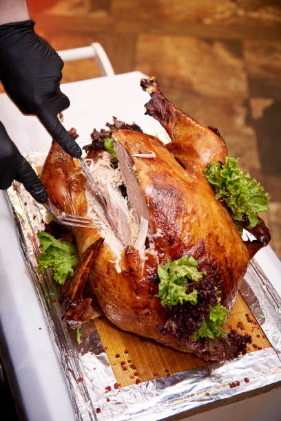 istock The chef cuts the turkey on a tray in a restaurant. 1129663517