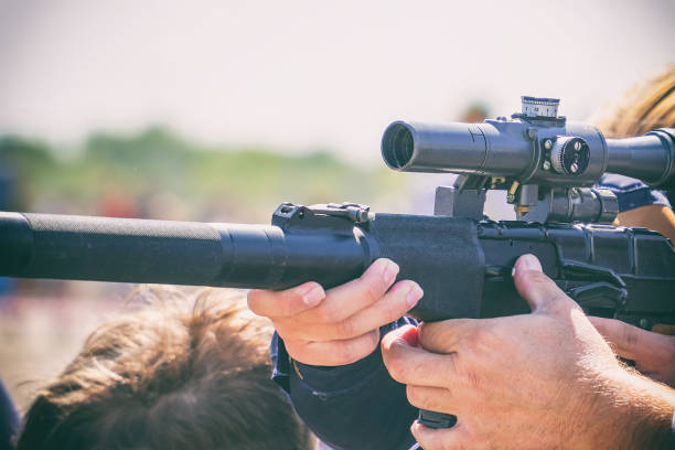 istock Rifle with an optical sight in hands of men 1129663732