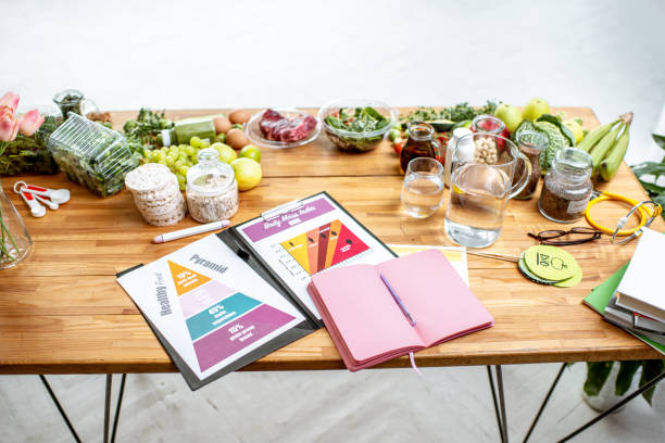 istock Nutritionists working place with food and documents 1129663888