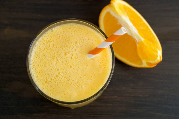 istock Healthy detox orange smoothie in a glass Cup. 1129664484