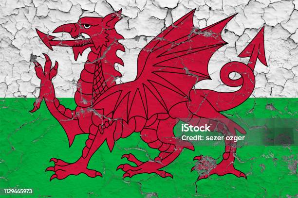 Flag Of Wales Painted On Cracked Dirty Wall National Pattern On Vintage Style Surface Stock Photo - Download Image Now