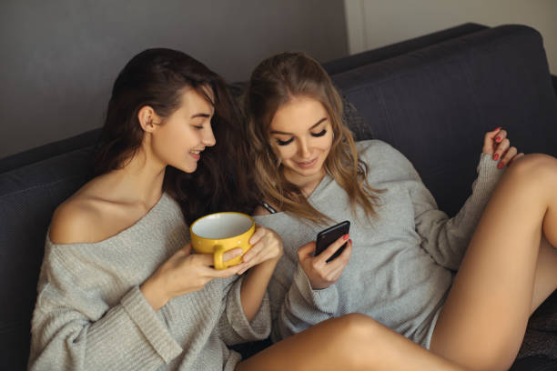 istock Two beautiful women resting indoors 1129666437