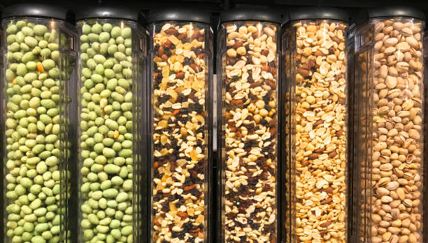 istock Assorted nuts in transparent plastic tubes at the groceries 1129666561