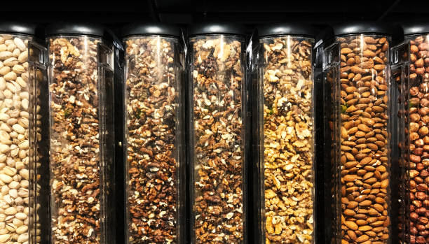 istock Close up assorted nuts in transparent plastic tubes for sale 1129666611