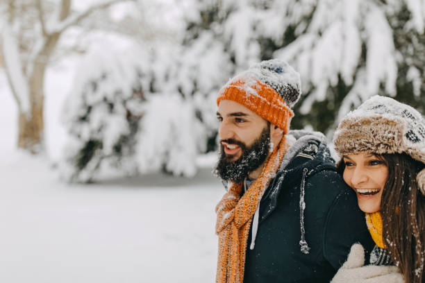 istock Couple in the snow playing 1129666911