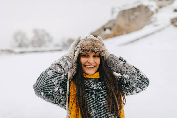 istock Young woman playing with dog 1129667521