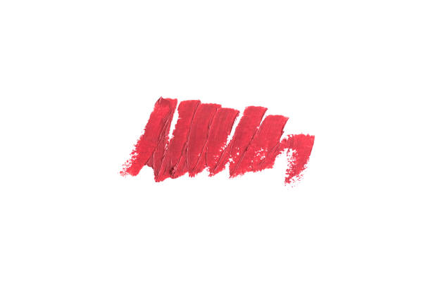 istock Delicate red textured lipstick stroke isolated on white. 1129667922