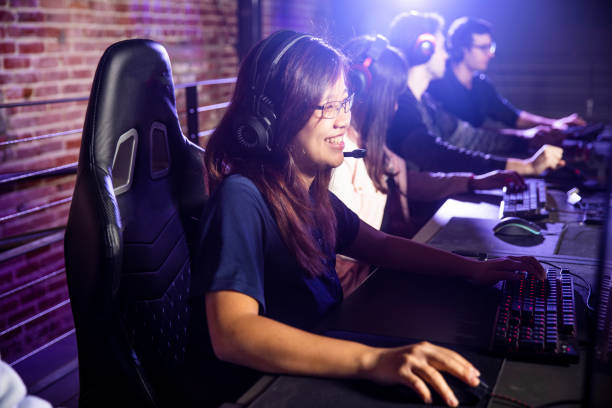 istock Young Asian Woman playing esports 1129668002