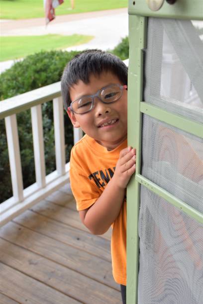 istock Series 1: Screen Door and Little Boy from South Korea 1129668022