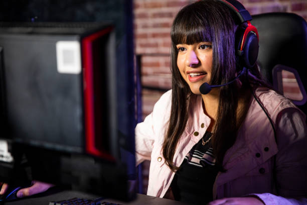 istock Young Woman playing esports 1129668231