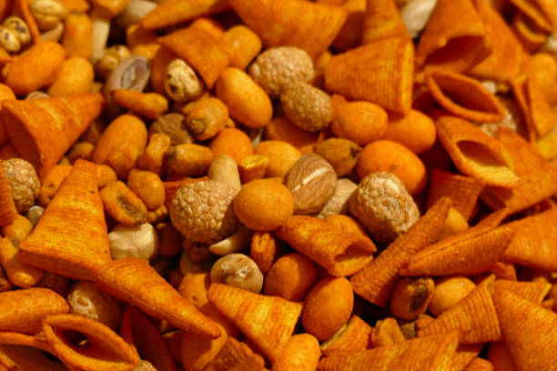 istock close-up snack foods, corn chips, nuts, almonds etc ... 1129668839