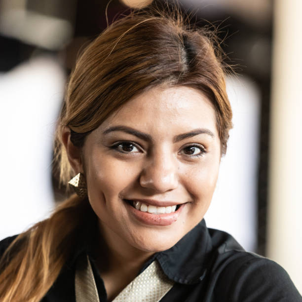 istock Hispanic young woman looking at the camera 1129669440