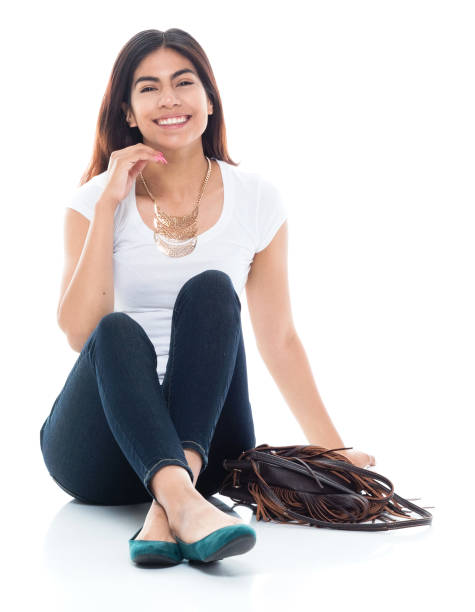 istock Cute female sitting on the ground 1129669555