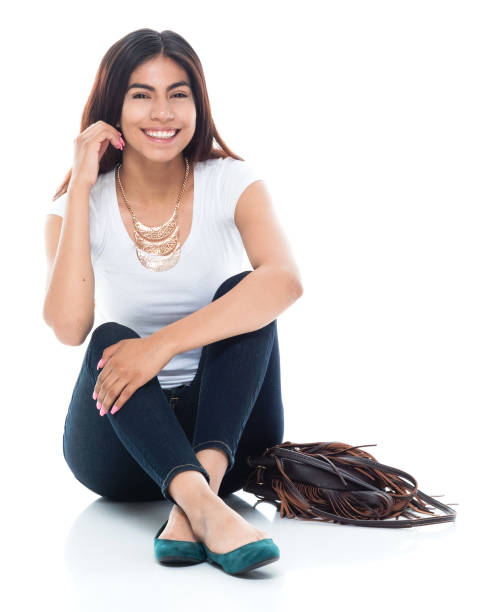 istock Cute female sitting on the ground 1129669556