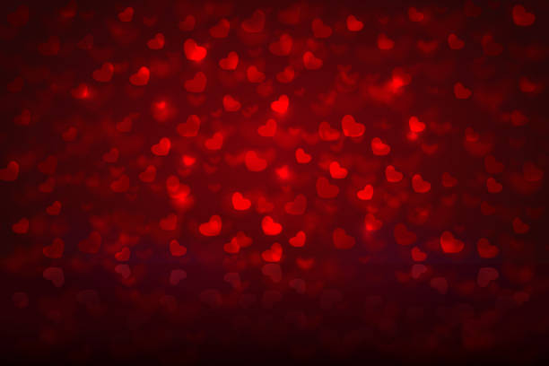 istock Red bokeh background with hearts for Valentines day and wedding 1129669588