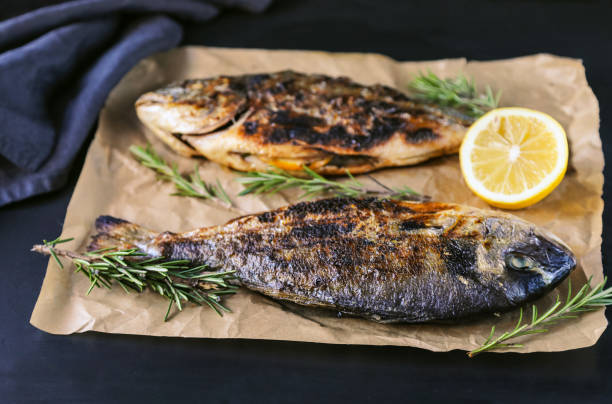 istock Grilled bream with spices and herbs. 1129670923