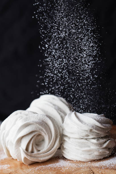 istock Food photography. Zephyr dusted with powdered sugar. 1129673843