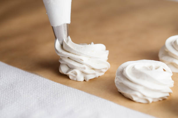 istock The process of making marshmallow. Sweet dessert white zephyr marshmallows close up. 1129673915