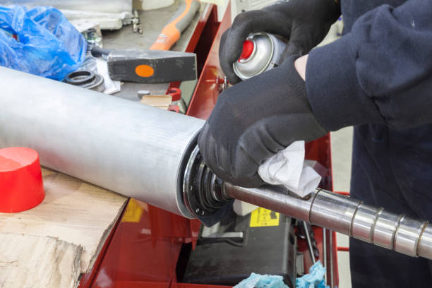 istock mechanic cleans large metal cylinder 1129674049