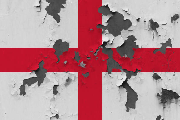 close up grungy, damaged and weathered england flag on wall peeling off paint to see inside surface. - english flag british flag flag grunge imagens e fotografias de stock